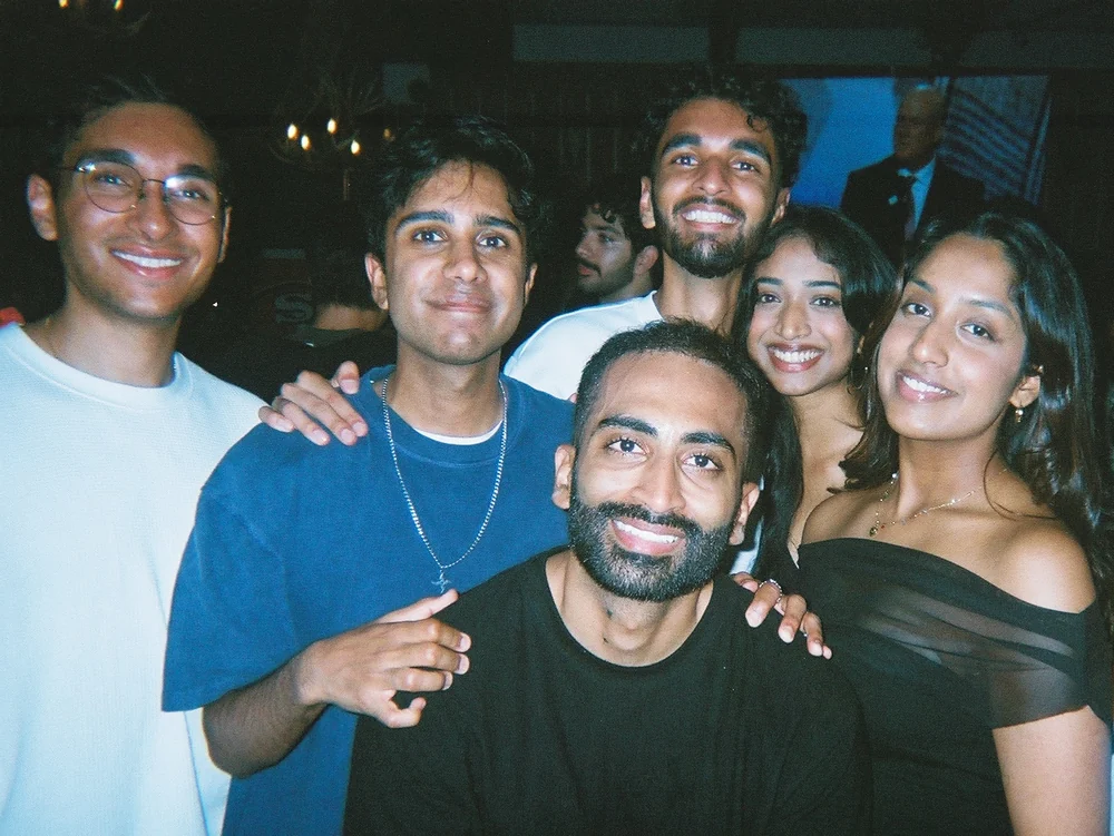 Film photo of friends smiling close together